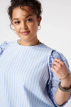 Blouse à carreaux avec manches bouffantes