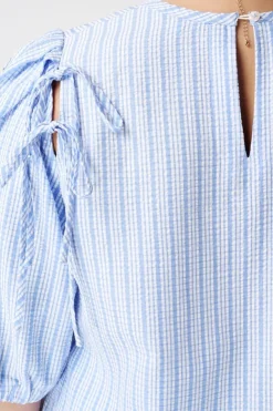 Blouse à carreaux avec manches bouffantes